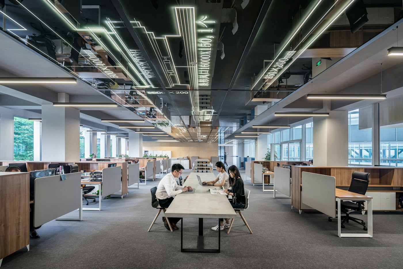 Open office floor with workstations and phones